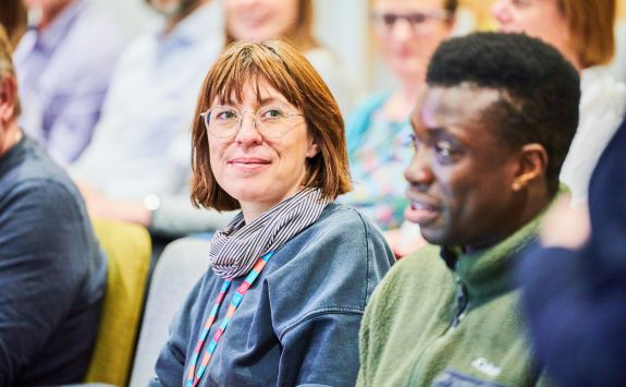 Two executive education students sat in a lecture theatre